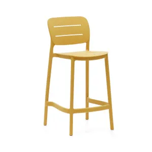 Morella stackable outdoor stool in mustard, 65 cm in height by Kave Home, a Tables for sale on Style Sourcebook